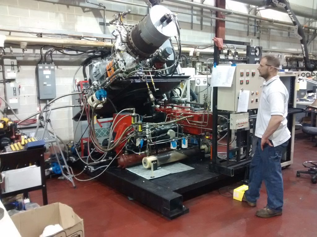 Industrial seal test rig tilting from horizontal to vertical orientation.
